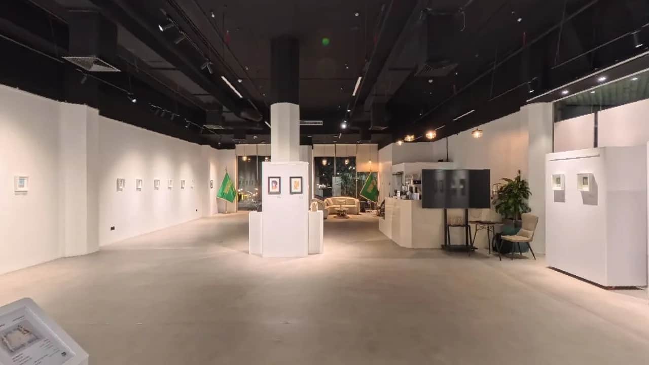Empty museum and exhibition interior with white display walls and exhibit areas, no people